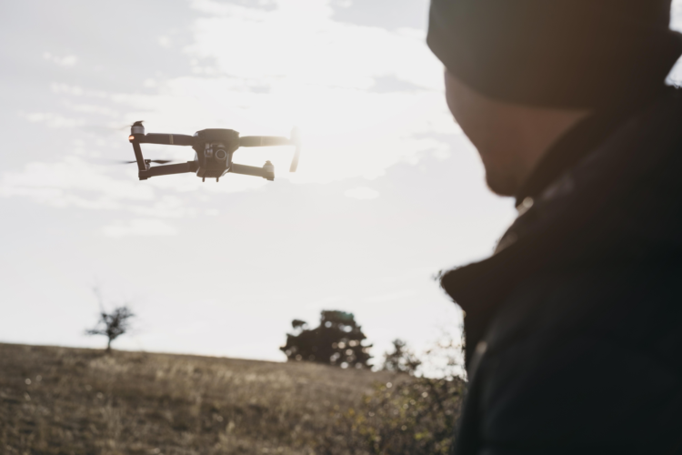 close-up-man-watching-drone.jpg